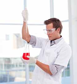 Scientist examinig a test-tube
